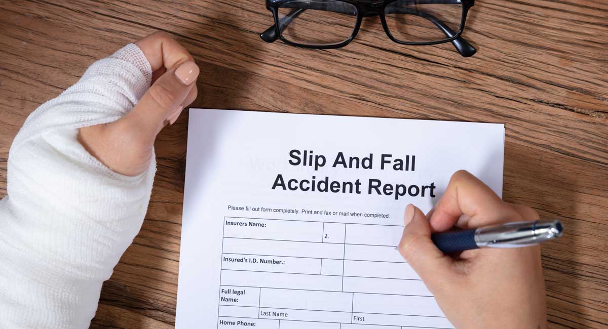 Woman Hand Filling The Slip And Fall Injury Report